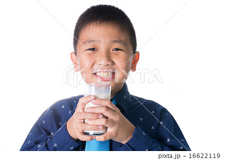 Happy boy with glass of milk in hand isolated Happy boy with glass of milk in hand isolated 16622119