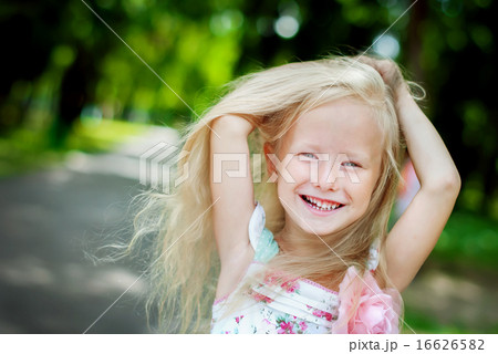 Cute Girl Posing with her Hair 16626582