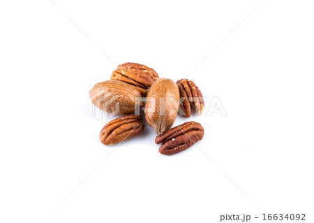 Few pecan nuts isolated on white Few pecan nuts isolated on white 16634092