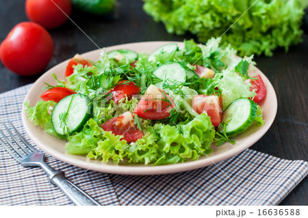 Tomato and cucumber salad with lettuce leafes 16636588