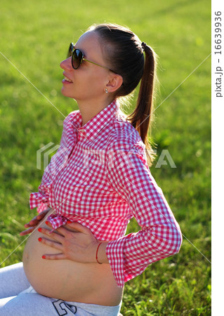 Pregnant woman outdoors 16639936