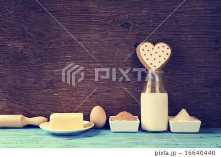 heart-shaped cookie and ingredients for cook it 16640440