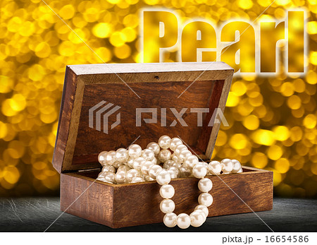 Wooden chest with white pearl necklace Wooden chest with white pearl necklace 16654586