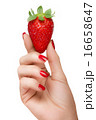 Female Hand Holding a Luscious Ripe Strawberry 16658647