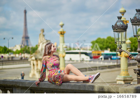 Beautiful young woman in the Tuileries garden Beautiful young woman in the Tuileries garden 16658789