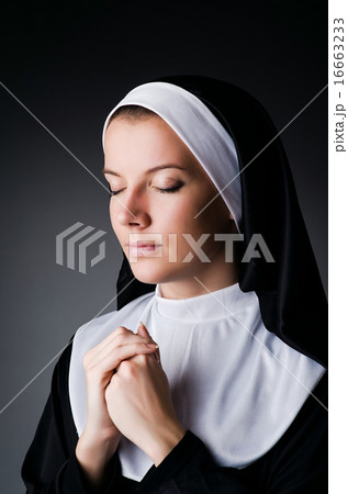 Young nun in religious concept 16663233