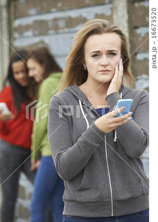 Teenage Girl Being Bullied By Text Message 16673520