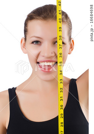 Young girl with centimeter in dieting concept Young girl with centimeter in dieting concept 16684698