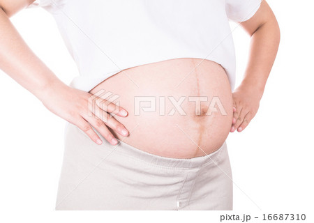 Pregnant woman hugs her belly 16687310