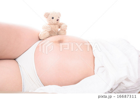 pregnant woman with hands and have bear doll 16687311