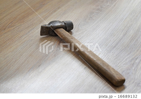hammer on the wooden floor 16689132