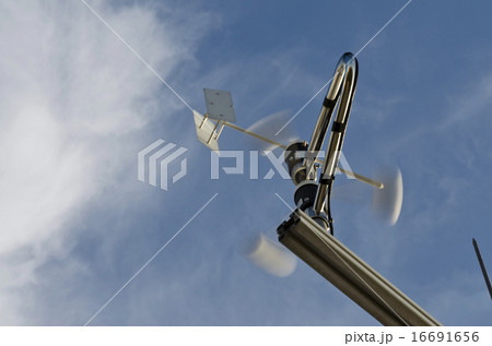 Anemometer and wind vane on blue sky Anemometer and wind vane on blue sky 16691656