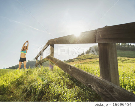 Woman stretching outdoors Woman stretching outdoors 16696454