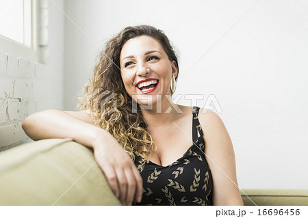 Woman looking away and laughing 16696456