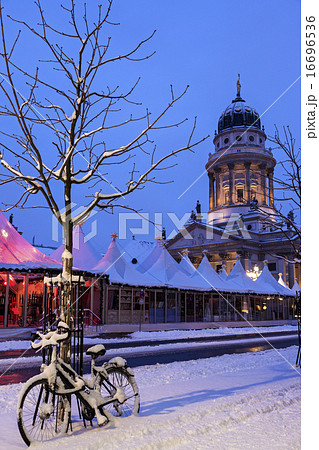 Gendarmenmarkt, Snowy bicycle parked against bare tree 16696536