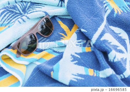 Sunglasses on towel 16696585