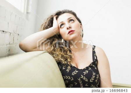 Woman looking up and daydreaming 16696843