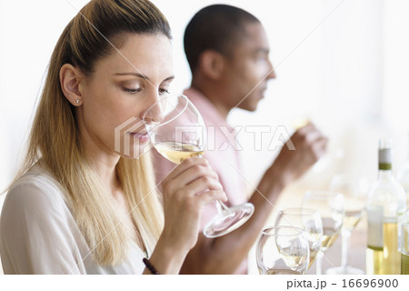 Man and woman tasting white wine 16696900