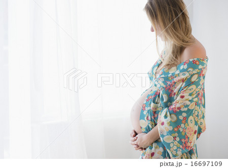 Pregnant woman in colorful dressing gown Pregnant woman in colorful dressing gown 16697109