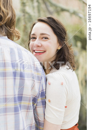Young smiling woman next to boyfriend 16697194