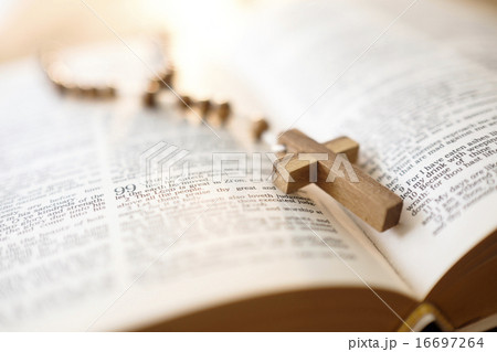 Rosary beads in open Bible 16697264
