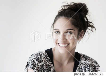 Portrait of teenage girl (14-15) smiling in studio Portrait of teenage girl (14-15) smiling in studio 16697372