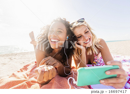 Female friends on beach Female friends on beach 16697417