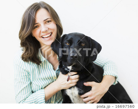 Portrait of smiling woman with dog Portrait of smiling woman with dog 16697560