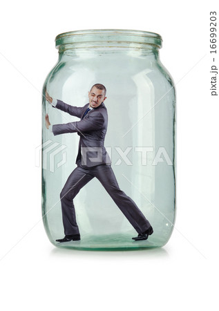 Young businessman in glass jar 16699203