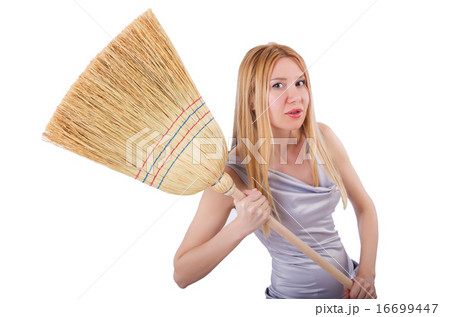 Young woman with broom on white 16699447
