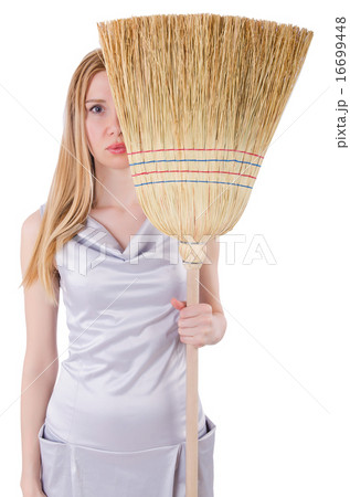 Young woman with broom on white Young woman with broom on white 16699448