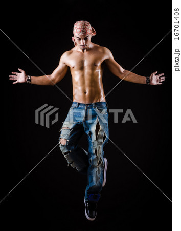 Dancer dancing in the dark studio 16701408