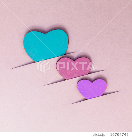 The wooden hearts on cardboard background.  16704742