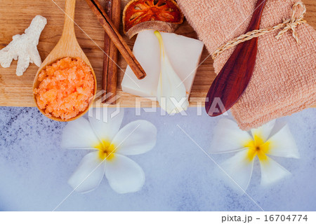 Spa and wellness treatment setup on wooden panel. Spa and wellness treatment setup on wooden panel. 16704774