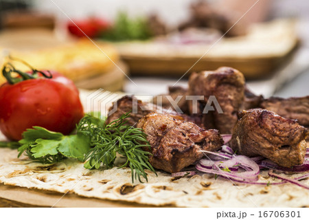 Grilled meat on plate with vegetables Grilled meat on plate with vegetables 16706301