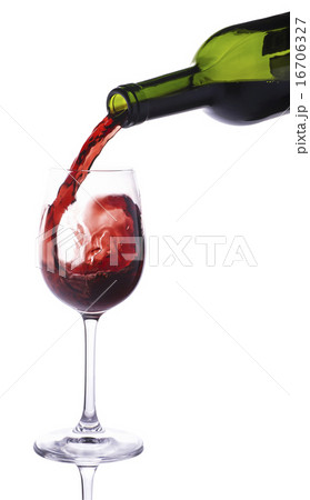Red wine pouring into small wineglass 16706327
