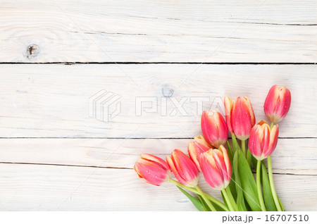 Colorful tulips on wooden table 16707510