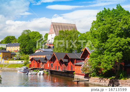 Finland. Old red wooden houses and trees 16713599