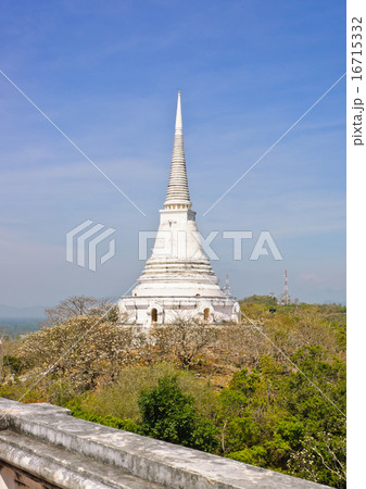 View of white pagoda on top of hill in Thailand 16715332
