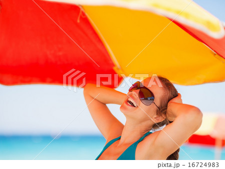 Happy woman enjoying vacation on beach Happy woman enjoying vacation on beach 16724983