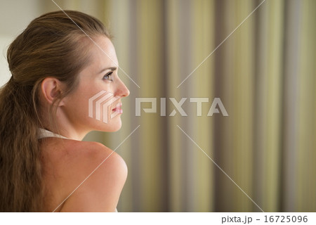 Profile portrait of thoughtful young woman looking on copy space Profile portrait of thoughtful young woman looking on copy space 16725096