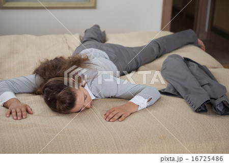 Tired business woman fall down from exhaustion in hotel room 16725486