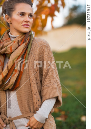 Portrait of young woman in autumn outdoors in evening Portrait of young woman in autumn outdoors in evening 16725917