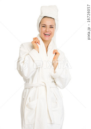 Portrait of smiling young woman in bathrobe 16726057