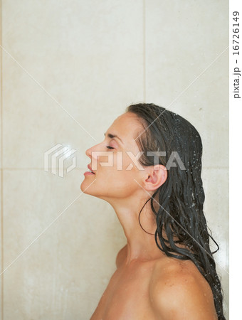 Young woman washing in shower 16726149
