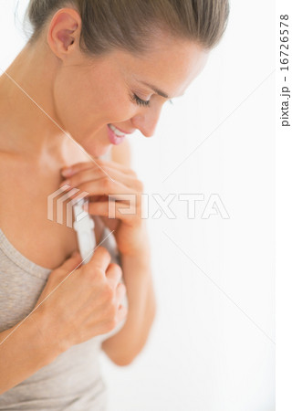 Happy young woman holding pregnancy test Happy young woman holding pregnancy test 16726578