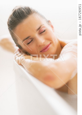 Portrait of relaxed young woman in bathtub Portrait of relaxed young woman in bathtub 16726951