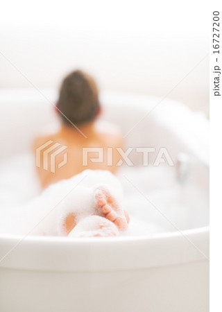 Closeup on young woman laying in bathtub Closeup on young woman laying in bathtub 16727200