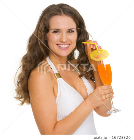 Smiling young woman in swimsuit with cocktail Smiling young woman in swimsuit with cocktail 16728320