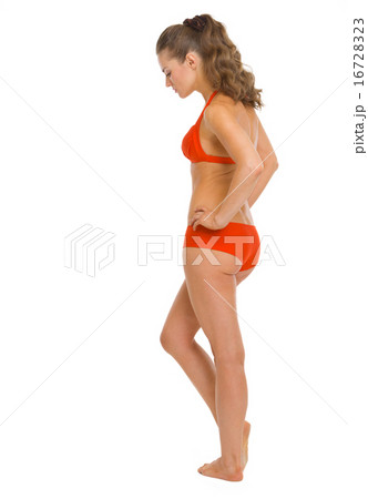 Full length portrait of thoughtful young woman in swimsuit . rea Full length portrait of thoughtful young woman in swimsuit . rea 16728323